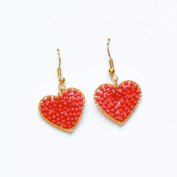 Red Heart Dangle Earrings, heart Shaped filled with glass beads. Size in width is 0.75 inches x 1.5 inches in length. Hypoallergenic, Handmade, Premier Quality, Super Lightweight. Perfect for gifts #style_earrings-only
